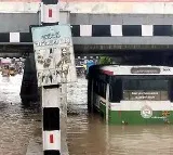 Warangal Floods RTC Bus Stuck Under Bridge Passengers Panic