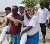 Tariq Anwar Seen Carried by Villager During Flood Relief Efforts