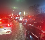 Hyderabad Rains Cars and Bikes swept away in flood waters