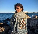 After director Maruthi, actress Malavika Mohanan now sports outfit bearing 'The Raja Saab' poster in Greece