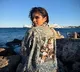 After director Maruthi, actress Malavika Mohanan now sports outfit bearing 'The Raja Saab' poster in Greece