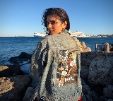 Malavika Mohanan in Greece with The Raja Saab poster dress