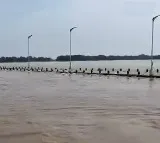 Munneru River in Spate Disrupts Traffic in NTR District