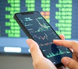 Sensex, Nifty end higher after hitting record levels