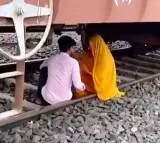 Lovers escape death under goods train while romancing