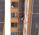 China Woman climbs down balcony to avoid husbands wife