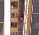 China Woman climbs down balcony to avoid husbands wife