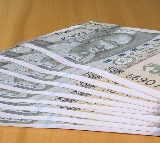 Rupee slides over weak global cues, FII outflows