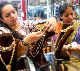 Gold rises to record high over strong safe haven demand