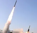 North Korea test-fires large-caliber multiple rocket launcher with Kim in attendance