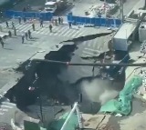 Shanghai Road Collapses Suddenly Creating Huge Sinkhole