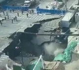 Shanghai Road Collapses Suddenly Creating Huge Sinkhole