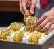 Gold dips marginally, silver drops near 2 pc as US dollar gains