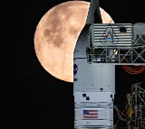 NASA returns moon mission rocket, spacecraft back to launch pad