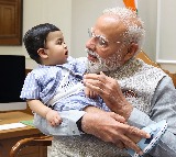 PM Modi cradles little Omy, melts hearts across social media​