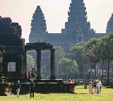Huge crowds of tourists enjoy equinox sunrise at Cambodia's iconic Angkor Wat