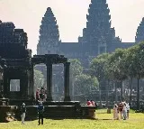 Huge crowds of tourists enjoy equinox sunrise at Cambodia's iconic Angkor Wat