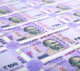 Rupee hits 95 mark against dollar amid oil surge, RBI curbs