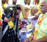 Home Minister Anita Bows to TDP Workers Feet