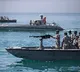 Iran's IRGC says hit Israel-linked vessel, ship ablaze