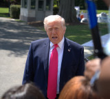 Trump warns Iran, sends team for talks