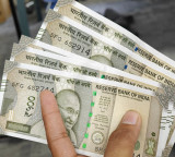 Rupee rises by 10 paise as crude rallies; precious metals fall nearly 2 pc