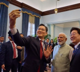 Samsung chief clicks selfie with PM Modi, S. Korean President at Noida facility
