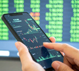 Markets end lower as crude oil surge weighs; mid, small caps outperform