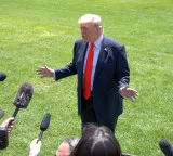 Trump reviews Iran deal, hints troop cuts