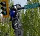 British Columbia Accident Bike crashes into car hangs on traffic light
