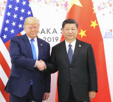 Trump faces pressure to confront China on rights, trade ahead of meeting with Xi