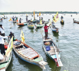 Nara Lokesh Welcomes Fishermen on 100 Boats at Krishna River