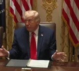 Trump says will not rush into Iran deal over midterm concerns