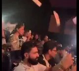 Upasana whistles throws papers during Ram Charans Peddi show
