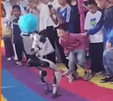 Humanoid Robot kicks child in stomach during performance in China viral video