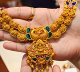 Gold, silver trade higher amid easing crude prices