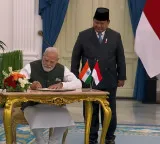 PM Modi signs guestbook upon meeting Indonesian Prez Subianto at Istana Merdeka