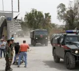 Two explosions injure 18 in Damascus as French President's visit proceeds as scheduled
