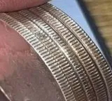 Isaac Newton and the fascinating story behind ridges on coin edges