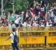 Cockroach Janata Party CJP protest victory as Education Minister Dharmendra Pradhan resigns