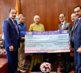 LIC MD R Doraiswamy presents dividend check to Nirmala Sitharaman