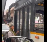 TGSRTC bus driver refuses to open door for woman in rain viral video