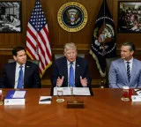 Trump touts record gains at Camp David