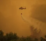 Two firefighting helicopters collide while battling wildfire in Greece