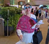 Kajol cuts birthday cake with paps at airport, shy Nysa Devgn stays out of frame