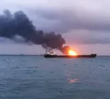 Strait of Hormuz attacks continue as another ship catches fire