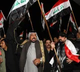 Iraqi militia umbrella group says 'postpones' retaliation against US forces