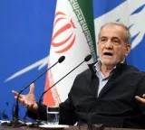 Iran's president says Tehran favors dialogue, but won't be forced to surrender
