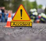 Kodada road accident private bus hits parked container six killed
