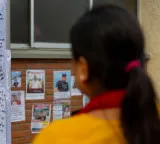 Families put up posters outside Kathmandu hospital in hope of finding their loved ones